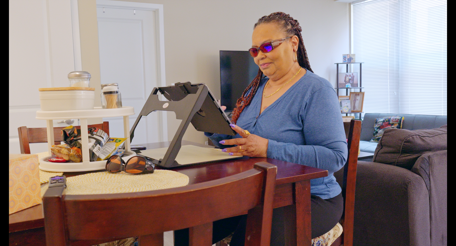 A veteran using assistive technology to access services